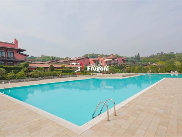 APPARTAMENTO PIANO TERRA IN  RESIDENCE CON PISCINA